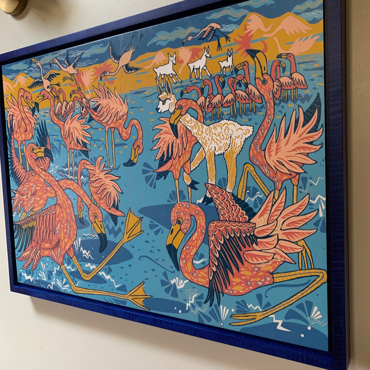 Flamingo and llama woodcut framed in blue