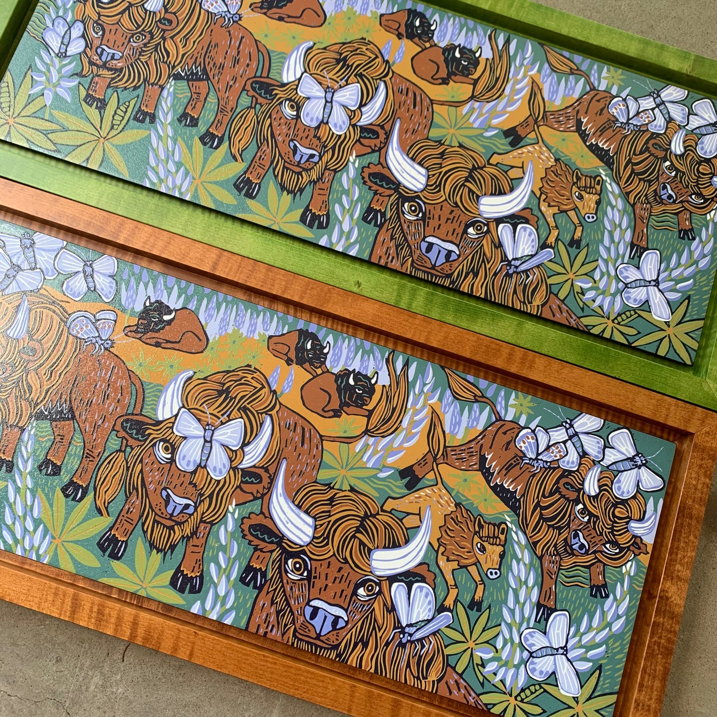 Bison and butterflies woodcut framed in natural curly maple