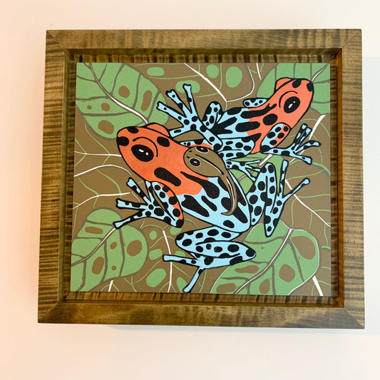 Dart frog woodcut framed in olive green solid tiger maple wood