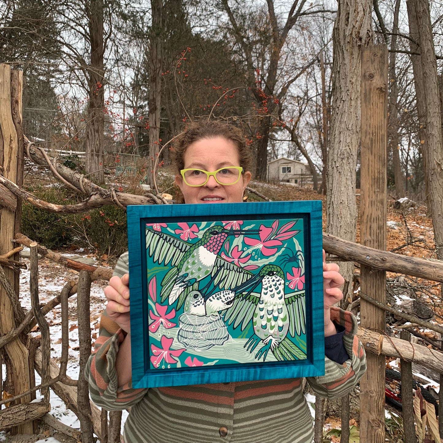 Hummingbird and spiderweb framed in turquoise