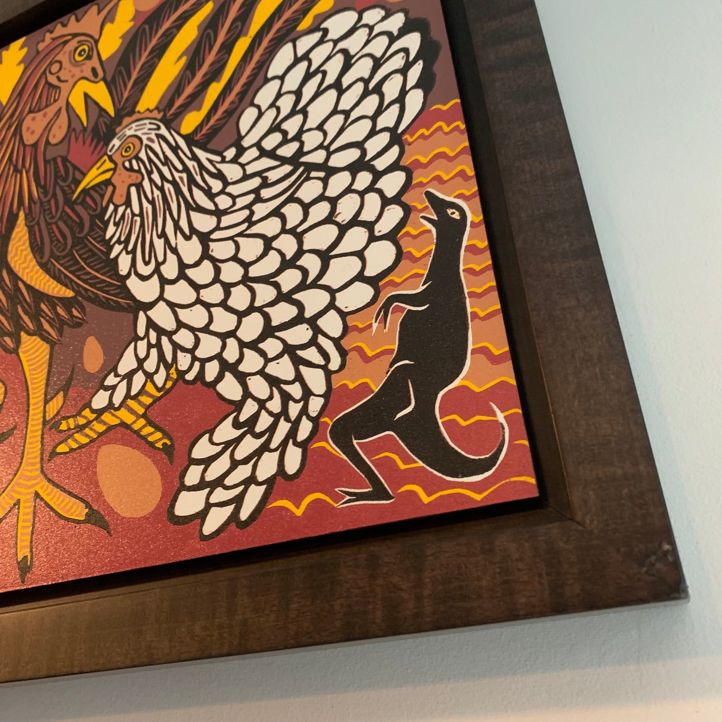 Chicken woodcut framed in black solid tiger maple wood
