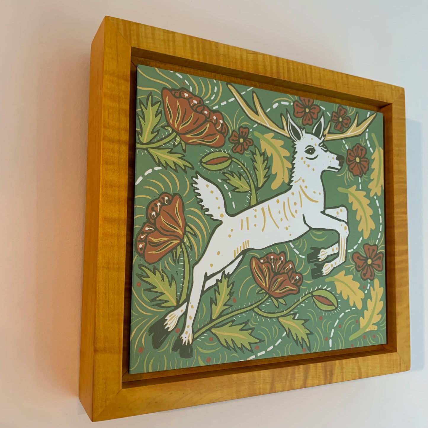 Seneca white deer framed in yellow solid tiger maple wood