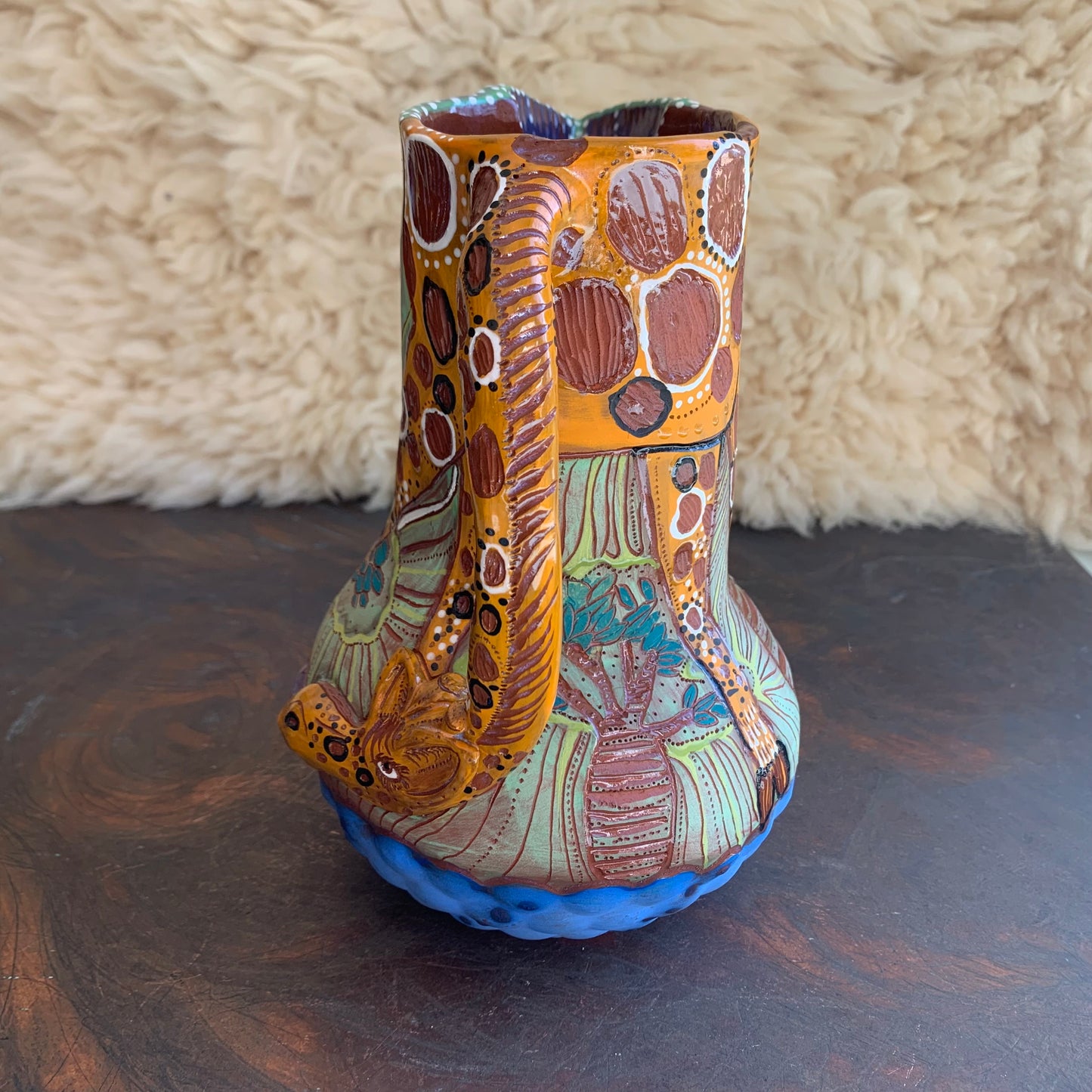 Giraffe pitcher with baobab trees