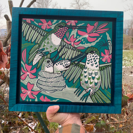 Hummingbird and spiderweb framed in turquoise